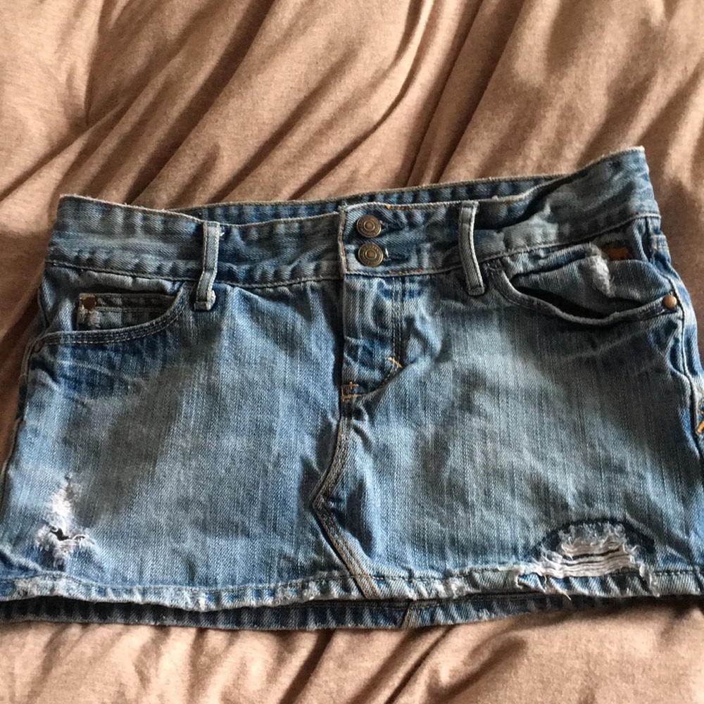 Slightly distressed denim mini skirt